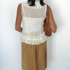 Jupe vintage asymétrique camel en matière peau de pêche – Taille 40